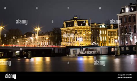 Amstel river in Amsterdam at night Stock Photo - Alamy