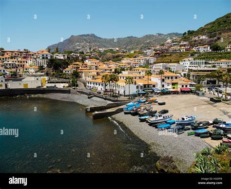 Colourful boats lie on the beach of Camara de Lobos on the Portuguese ...