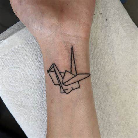 Origami Crane Tattoo on Wrist by Rosie May