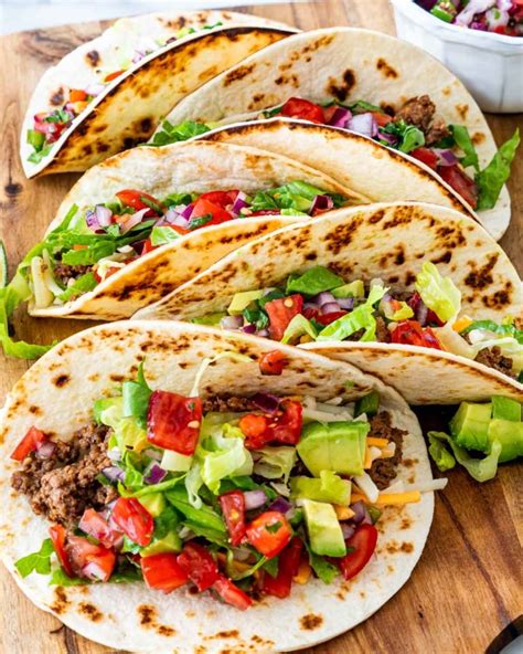 Easy Ground Beef Tacos ideal for busy weeknights! Add your favorite taco toppings and dinner is ...