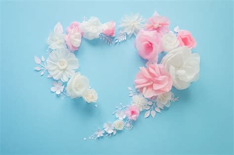 Premium Photo | White and pink paper flowers on pink