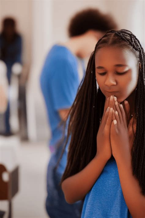 Teenage Girl Praying at Church · Creative Fabrica