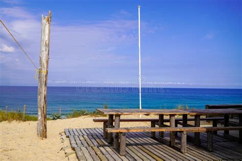 Wooden Chairs and Tables Empty on Wood Terrace of Oysters Bar Restaurant in Beach in Bay ...