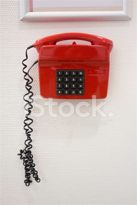 Telephone From The 80s Hanging On A White Wall Stock Photo | Royalty ...