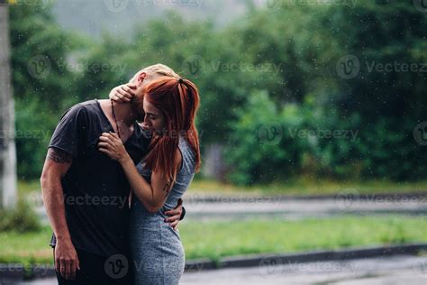 beautiful couple hugging in the rain 11487658 Stock Photo at Vecteezy