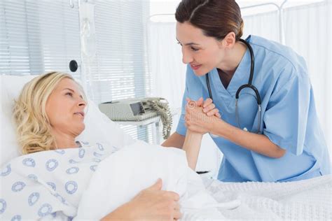 Doctor Taking Care of Patient Stock Photo - Image of health, doctor ...