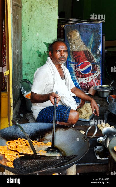 An Indian man cooking street food Stock Photo - Alamy