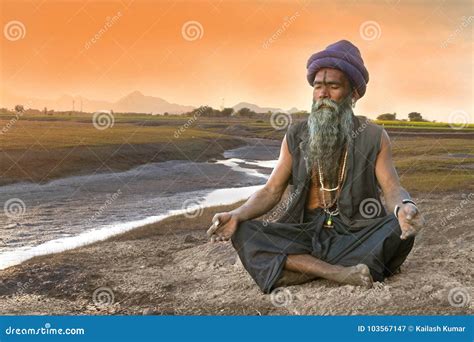 Sadhu Meditation Near River Stock Image - Image of males, colors: 103567147