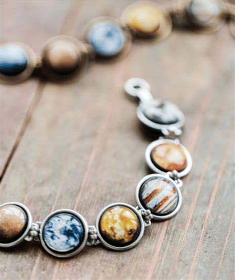 Solar System Necklace and Bracelet Are a Perfect Pair of Planet Jewelry