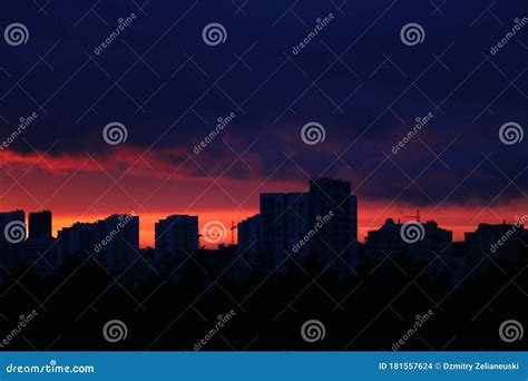 Beautiful Sunset in the City. Silhouette of Houses and Construction ...