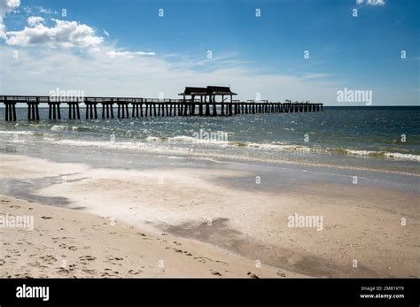 Under Naples Pier after Hurricane Ian and the beach Stock Photo - Alamy