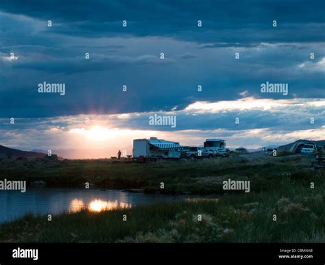 Camping site at the mountain lake Stock Photo - Alamy