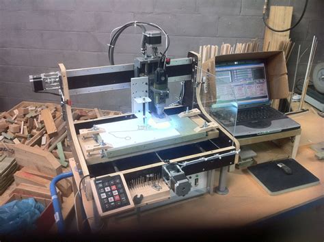 My updated homemade CNC machine with new Proxxon router, new pen holder ...