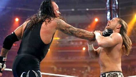 WWE legend The Undertaker hated Shawn Michaels so much he 'Probably wouldn't p*** on him if he ...