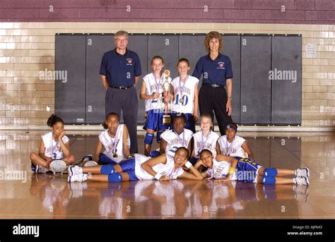 Youth basketball team poses for a picture after winning the tournament Stock Photo - Alamy