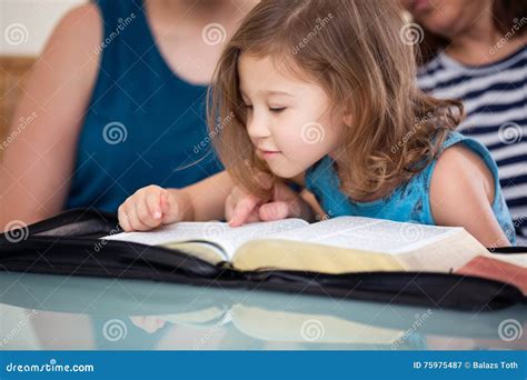 Family Reading the Bible Together Stock Image - Image of faith, bible: 75975487