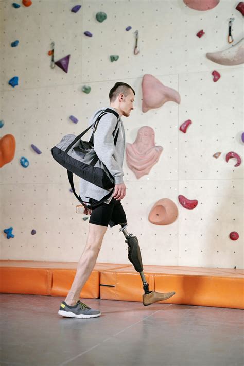 Man Carrying His Gym Bag and Water Bottle · Free Stock Photo