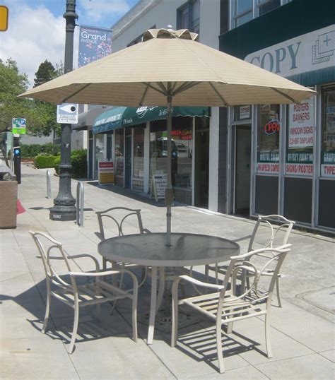 UHURU FURNITURE & COLLECTIBLES: SOLD - Patio Set with Umbrella - $200