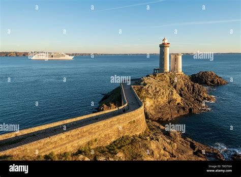 France, Finistere, the lighthouse of the Petit Minou at sunset and the ship Europa Stock Photo ...