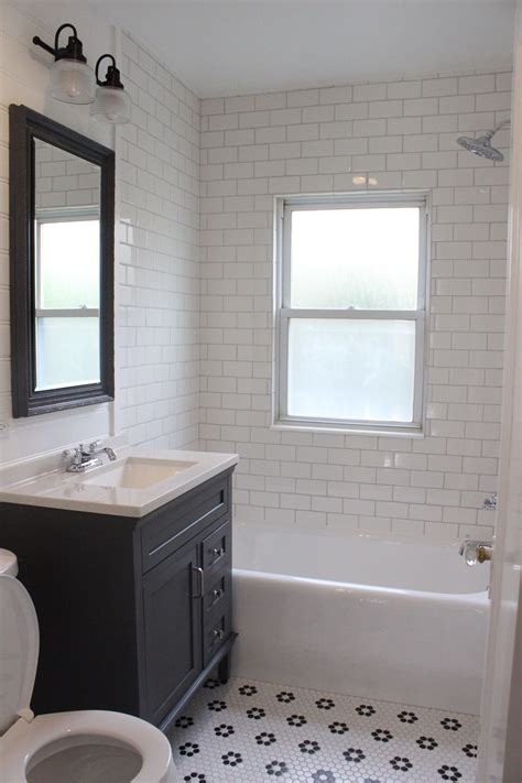 Farmhouse style bathroom remodel | White subway tile shower | Gray vanity | Blac… | White subway ...