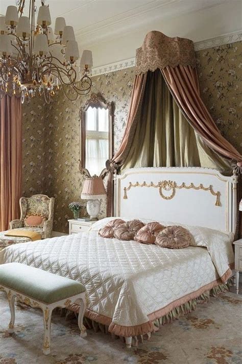 a fancy bedroom with an ornate bed and chandelier
