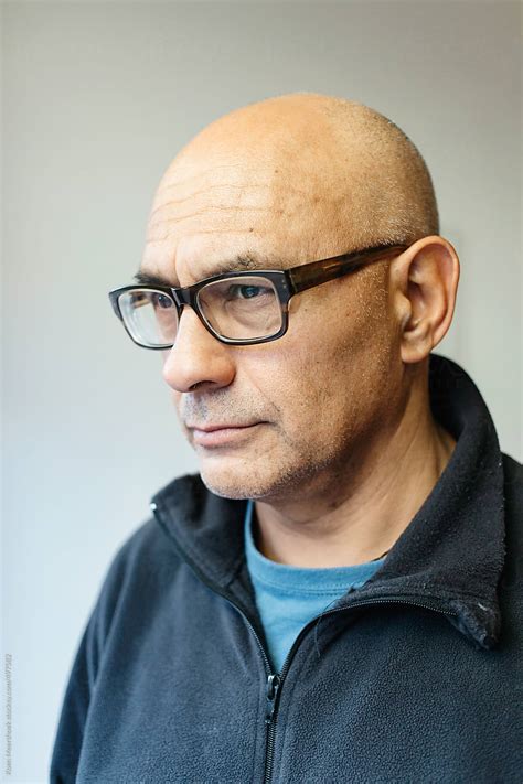 "Portrait Of A Bald Man With Glasses Looking Serious." by Stocksy ...