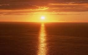 optics - Why does sunset over a body of water cause a path of light stretching towards the ...