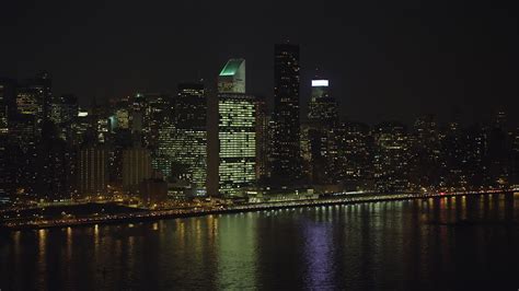 5K stock footage aerial video approach the United Nations building in Midtown Manhattan, New ...