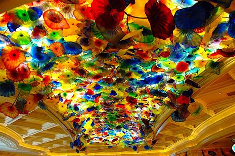 Dale Chihuly's Bellagio ceiling. Those are individual blown glass flowers layered and backlit ...