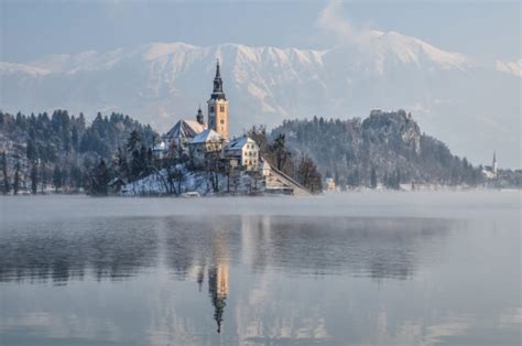 Photo Gallery: Lake Bled draped in winter white in the winter