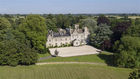 A jaw-dropping Cotswold manor with indoor AND outdoor arenas, set within perfect hacking ...