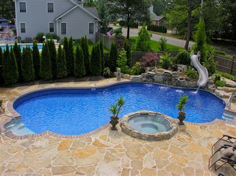 Swimming pool designs with slides | Hawk Haven