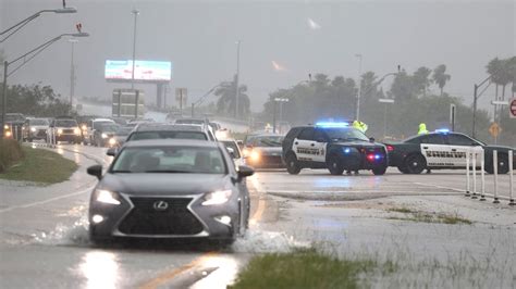 Torrential storms batter South Florida, close key airport