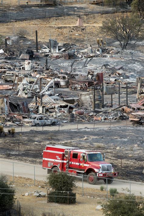 Homes burned by California fire; teams look for more damage