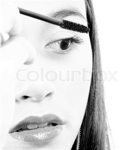 Young Girl Applying Some Mascara To Her ... | Stock image | Colourbox