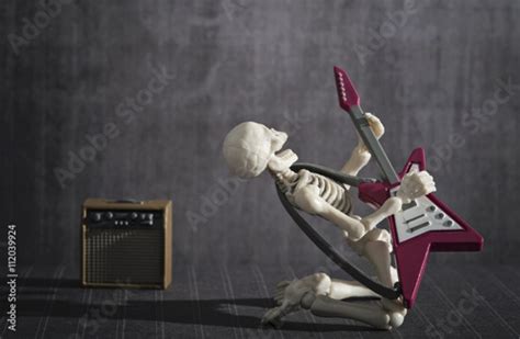 A Skeleton playing rock electric guitar Stock Photo | Adobe Stock