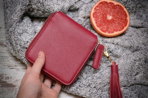 Premium Photo | Fashion concept. small red purse in a female hand