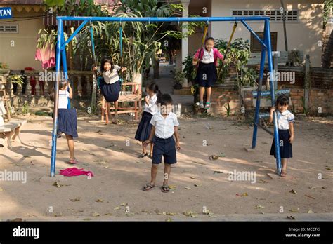 Asian schoolchildren - Young Cambodian primary school children in school playground, Siem Reap ...