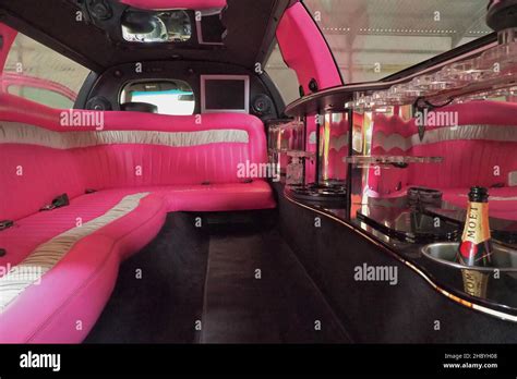 Luxury interior of a stretch limousine with pink upholstery, vintage ...