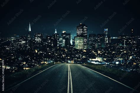 Road leading to night city Stock Photo | Adobe Stock