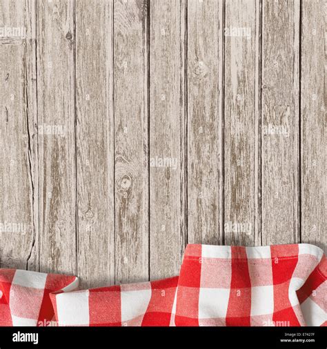 old wooden table with red picnic tablecloth background Stock Photo - Alamy