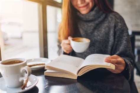 A Beautiful Woman Reading a Book while Drinking Coffee in Cafe Stock Image - Image of cafe ...