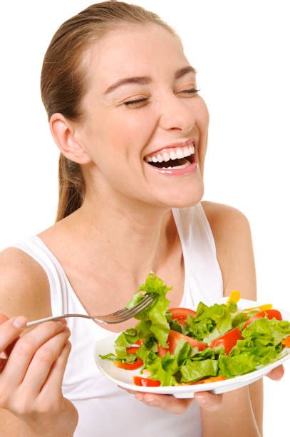 Royalty Free Women Laughing While Eating Salad Pictures, Images and ...