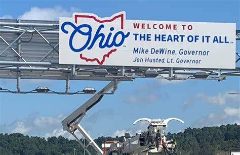 New signs welcoming travelers to the “Heart Of It All”