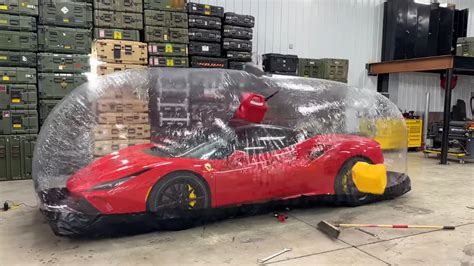 Watch A YouTuber Throw Ladders And Stuff At A Ferrari Parked In A Plastic Storage Bubble - The ...