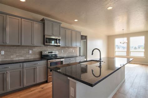 Grey Granite Countertops With Brown Cabinets: A Timeless Combination