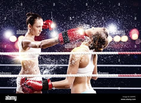 Two women boxing in ring Stock Photo - Alamy