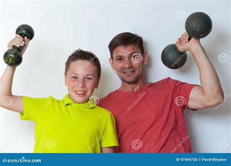 Smiling Father and Son Working Out with Dumbbells Stock Photo - Image ...