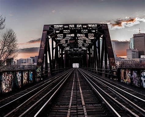 Train bridge at sunset : r/pics