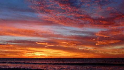 HD wallpaper: Sky meets the ocean at sunset, orange sunset sky, beaches ...